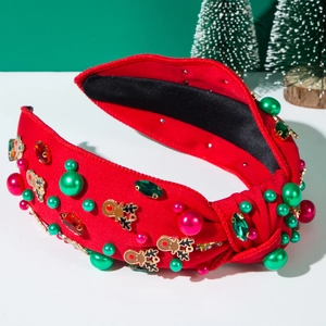 Detailed view of red Christmas headband with rhinestones, pearls and golden deer charms