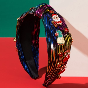 Sparkly Christmas headband with Santa motifs and colorful fabric on a festive background