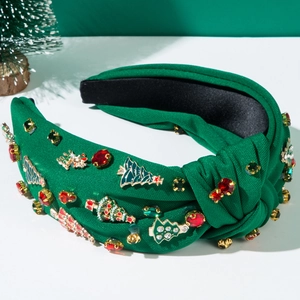 Detail of forest green knotted headband featuring rhinestone-encrusted Christmas tree charms