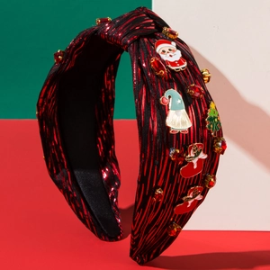 Detail of red and black striped Christmas headband with Santa and enamel charms