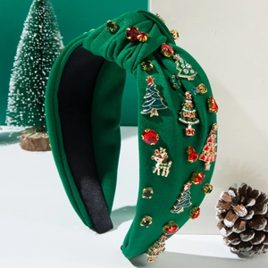 Knotted green Christmas headband with golden reindeer and rhinestone tree decorations