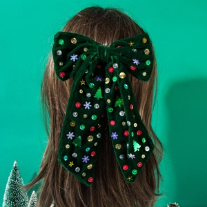 Fermaglio natalizio in velluto verde scuro con fiocco e paillettes a forma di stelle