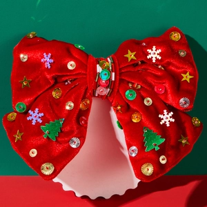 Nœud de cheveux de Noël en velours rouge avec étoiles dorées et paillettes sur support