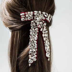 Red velvet bow hair clip with luxury sparkling rhinestones on brown hair
