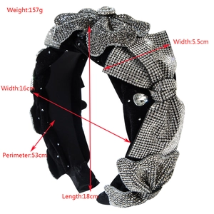 Elegant black velvet headband with shimmering silver rhinestones and a large bow design