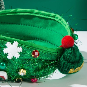 Detail of Christmas headband with green glitter fabric, sequins, and Love knit hat