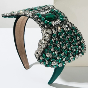 Macro detail of luxury green velvet headband with hand-set crystals and rhinestones