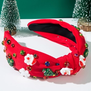 Detail of Christmas headband featuring sparkling rhinestones and Santa Claus ornaments