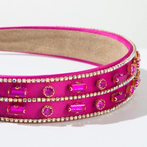 Detailed shot of hot pink satin headband with inlaid rhinestones and soft suede lining