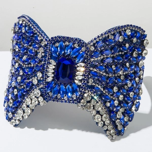 Luxury dark blue bow headband featuring sparkling rhinestones for elegant party fashion styling