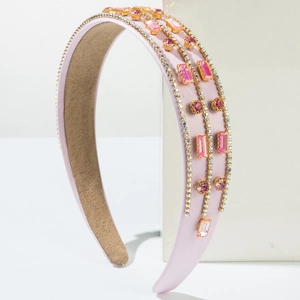 Elegant pink satin headband featuring three rows of sparkling rhinestones and crystals