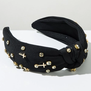 Detail of black knotted headband with rhinestones and gold metal cross ornaments