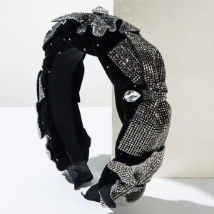 Luxurious black velvet headband with shimmering rhinestones and teardrop crystal detail