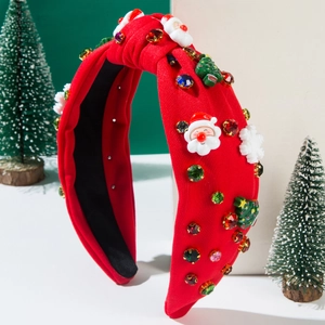 Detail of Christmas headband with Santa, tree charms and colorful rhinestones