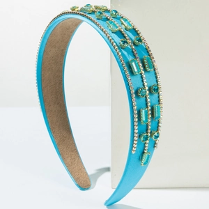 Elegant blue satin headband with vertical rows of sparkling rhinestones and gems