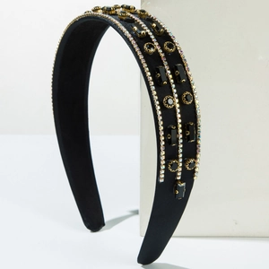 Detail of black satin headband with triple rows of rhinestones and vintage gemstones