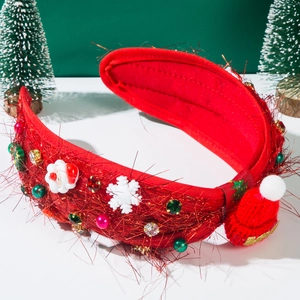 Detailed shot of festive Christmas headband with red velvet, mini Santa and knit hat decor