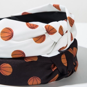 Two-piece set of wide-brim knotted headbands featuring orange basketball print designs