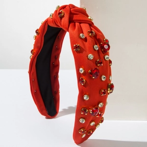 Orange knotted headband with sparkling red heart rhinestones for elegant styling