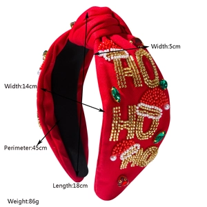 Christmas red knotted headband with beaded HO HO HO letters and holiday patterns