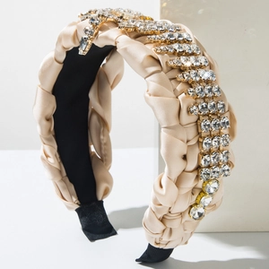 Cerchietto intrecciato champagne con strass di lusso e design imbottito in raso