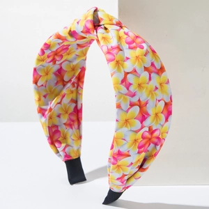 Bohemian floral fabric headband with yellow frangipani print and stylish knotted design