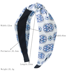 Weißer geknoteter Haarreif mit blauem Evil-Eye-Print und breitem Rand für Haarstyling