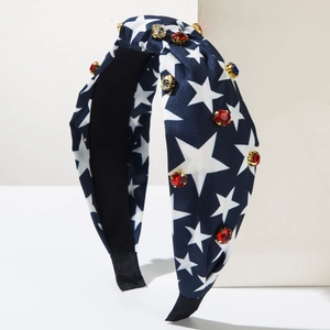 Detail of USA flag knotted headband with rhinestones and white stars on blue fabric
