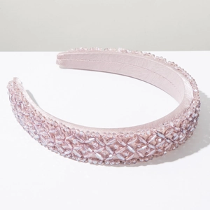 Detailed close-up of handmade pink crystal beaded headband with luxurious satin base