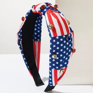 Detail of USA flag headband with patriotic stripes and sparkling rhinestone accents