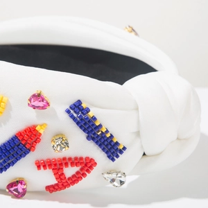 Baroque white woven headband with colorful beadwork and pink heart-shaped crystal
