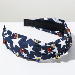 Close-up of knotted headband with stars pattern and sparkling red white blue rhinestones