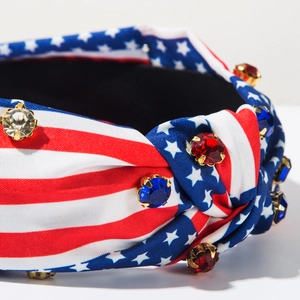 Close-up of knotted US flag headband with colorful rhinestones and gold metal claw settings