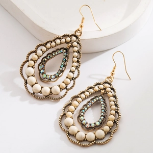 Bohemian teardrop earrings with white stones and crystal rhinestones in gold setting