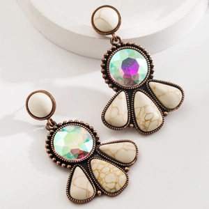 Detail of vintage bronze drop earrings featuring colorful crystal and white turquoise stones