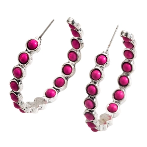 Silver geometric hoop earrings with vibrant pink turquoise beads on a white background