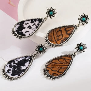 Bohemian teardrop earrings with cow print and brown leather texture for a western vintage look