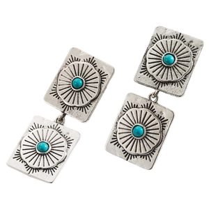 Detail of vintage silver square drop earrings with sunburst pattern and turquoise stones