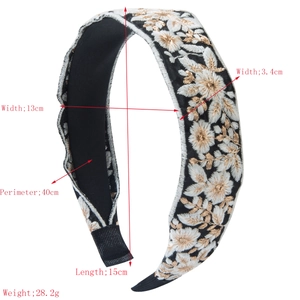 Bohemian wide embroidered flower headband in black with white and gold floral stitching