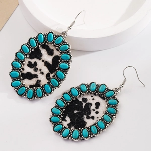 Vintage bohemian turquoise leather earrings with western cow print pattern and hooks