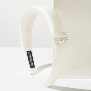 Elegant ivory padded headband with three rows of pearls and handmade fabric finish
