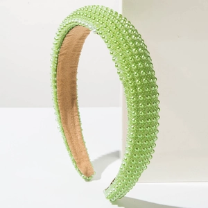 Detail of light green pearl headband with non-slip lining and thick sponge base