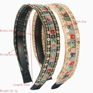 Bohemian embroidered headband with colorful ethnic patterns and golden sequins details