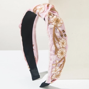Pink embroidered floral headband with gold sequins and soft fabric texture for women