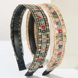 Detail of bohemian embroidery headbands with golden sequins and anti-slip toothed design