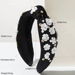 Elegant black knotted headband featuring white fabric flowers, pearls and rhinestones