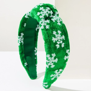 Festive green velvet knotted headband with white sequin snowflakes for Christmas party decor
