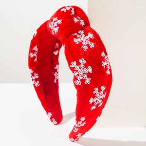 Red Christmas headband with festive white snowflake embroidery and stylish top knot design