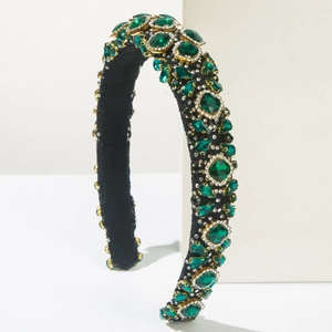 Luxury Baroque headband featuring emerald green crystals and rhinestones on black fabric