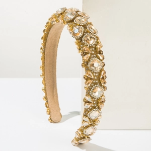 Close-up of baroque headband with luxury champagne crystals and golden beads